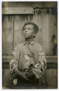 Jewish beggar, boy, Vilnius, Lithuania, poverty, hunger, hardship, orphan, cigarette, World War I,