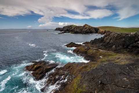 Rocky coastal landscape with surf and cliffs on the Shetland Islands, Mainland, Scotland, Great