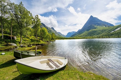 Rowing boats on the shores of Lake Litlvatnet, Innerdalen High Valley, Innerdalstårnet Mountain