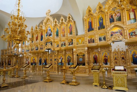 A large golden iconostasis with numerous icons in an orthodox church interior, Nicoreni monastery