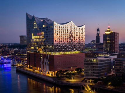 Aerial view of the sunrise on the Elbe with Elbe Philharmonic Hall and St Michael's Church