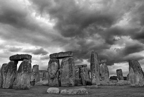 Stonehenge ca, a megalithic structure from the Neolithic period, rain clouds, black and white,