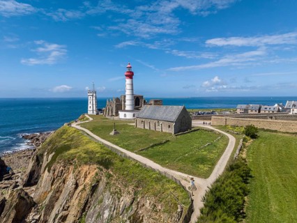 Aerial view of the distinctive red and white lighthouse Phare de Saint-Mathieu on the Breton coast