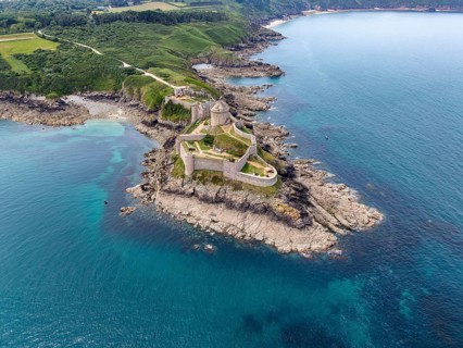 Aerial view of the historic rock castle Fort la slat, Château de la Roche Goyon on a rocky headland