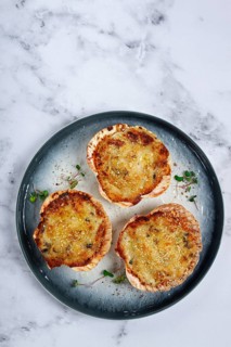 Scallop shells, stuffed, baked with cheese, in the oven, julienne with scallops