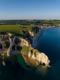 Aerial view of the Falaise d'Amont rock formation with the Porte d'Amont rock gate, Étretat,