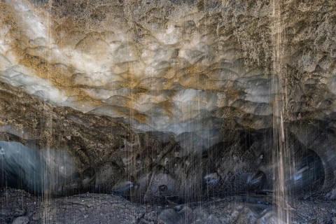 Meltwater at a glacier cave, underground glacier stream, Castner Glacier, Delta Range, Alaska