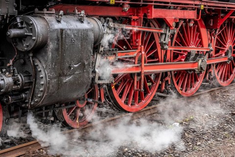 Detailed view of the drive wheels and coupling rods of a steam locomotive, Bochum railway museum,