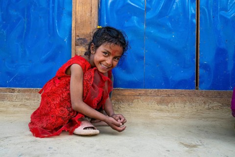 A little smiling girl playing with stones, Hindu ethnic group, Himalayas, Humla region, western