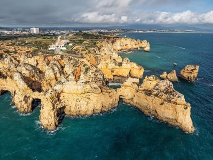 Aerial view of Ponte da Piedade in Lagos, Algarve, Portugal, with limestone ridges, ocean and sea