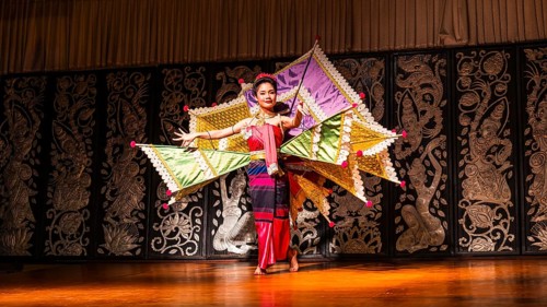 Young Thai woman with fan-like wings showing a traditional dance, Old Chiang Mai Cultural Center,