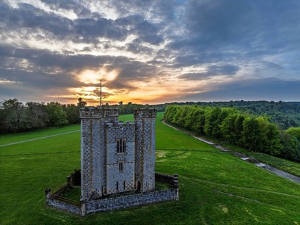 Sunset over Hiorne's Tower from a drone, Arundel, West Sussex, England, United Kingdom