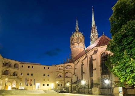Atmospheric night view, courtyard of the castle with castle church and church tower, Luther city