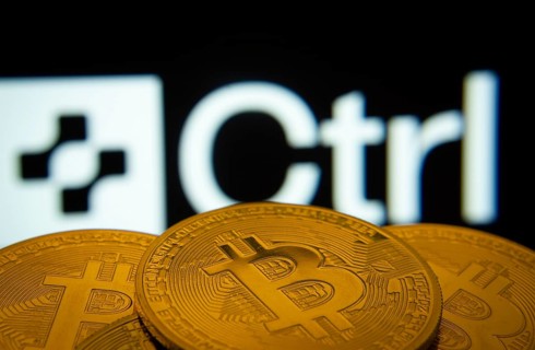 Dhaka, Bangladesh- 27 March 2025: Close-up of Bitcoin coins with the Ctrl Wallet logo visible on a