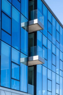 Modern commercial building on Lake Phoenix, glass façade with balconies, detail, Hörde, Dortmund,
