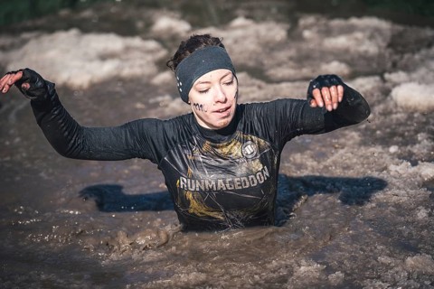 WROCLAW, POLAND - APRIL 7, 2018: Extreme running with obstacle RUNMAGEDDON. In the picture a runner