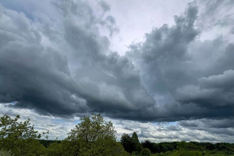 Dark cloud front with Nimbostratus classic rainlayer cloud Thunderstorm potential following