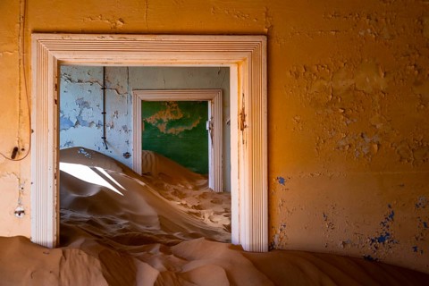 Interior view, doors and house full of sand, former diamond mining town, Namib Desert, Kolmanskop,