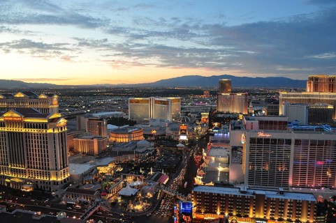 View of Las Vegas at sunset with illuminated hotels, Las Vegas, Nevada, USA