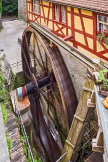 Schlossmühle, watermill, historic water wheel, old town, half-timbered house, motion blur, elevated