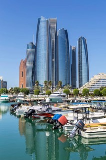 Abu Dhabi Skyline Etihad Towers skyscrapers with marina yacht harbor in Abu Dhabi, United Arab