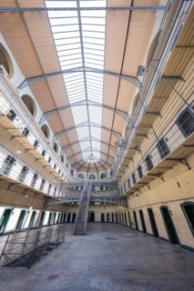 Wide prison interior with steel and glass structure, Kilmainham Gaol Prison, Dublin, Ireland