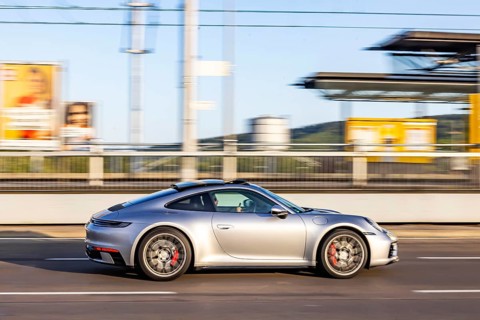 Car on the road in the city center. Porsche 911. Mitzieher.Stuttgart, Baden-Württemberg, Germany