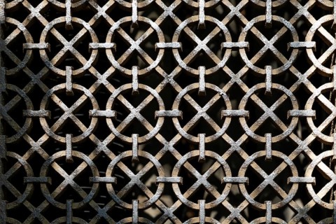 Ornate wrought iron grid, greenhouse, Chelsea Physic Garden, historic botanical garden, oldest