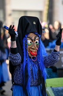 Member of a fools' guild in traditional Haes, fools' clothes, during the carnival procession in
