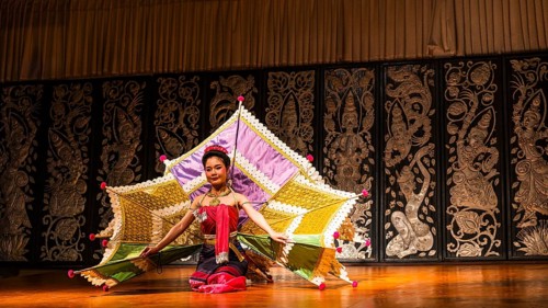 Young Thai woman with fan-like wings showing a traditional dance, Old Chiang Mai Cultural Center,