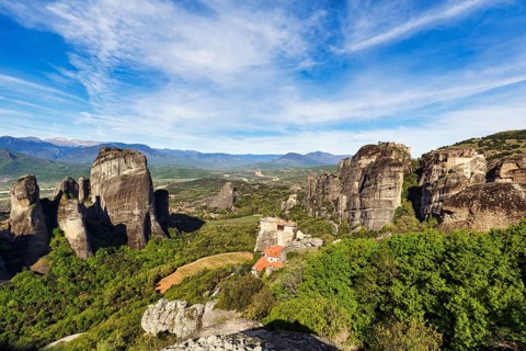Hermitages between high rocks, monasteries on sandstone formations, Meteora, Cirrus, spring