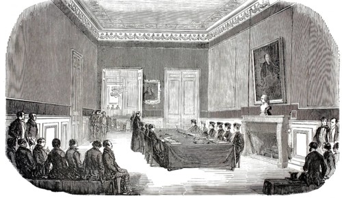 Exterior view of the École de Droit, Faculty of Law, in Paris. Exam in the boardroom, a student