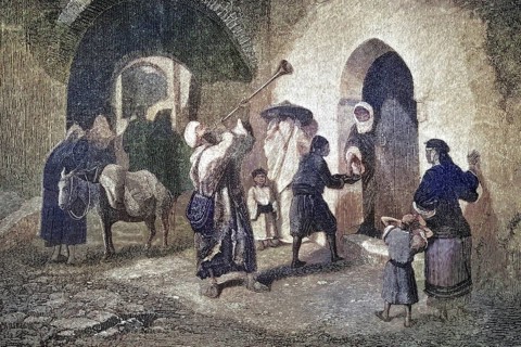 Street scene in which a dervish blows a trumpet or a long horn to demand donations, handouts for