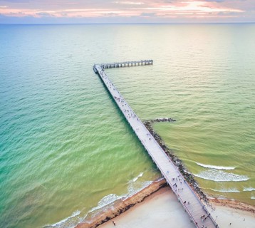 Palanga main bridge from above with tourists and baltic sea aves crashin.Holidays in baltics.