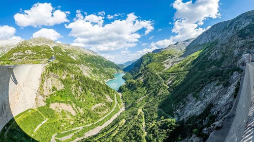 Panoramic view from the air side facing away from the water side of 200 meter high dam dam