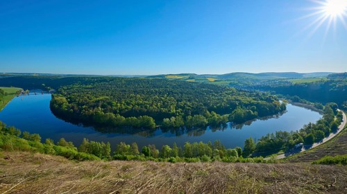 Sunlight sparkles over a picturesque river landscape, Mainschleife, Urphar, Wertheim, Main Tauber