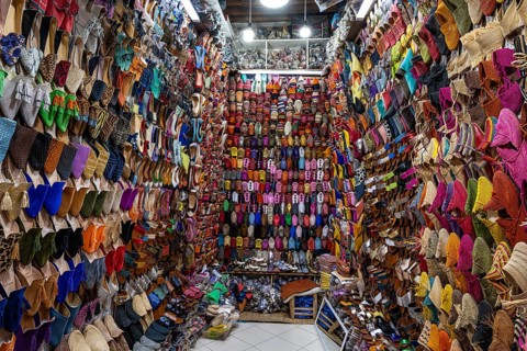 Countless babouches, traditional slippers, Arab and Berber Moroccan leather shoes in a sales stand,