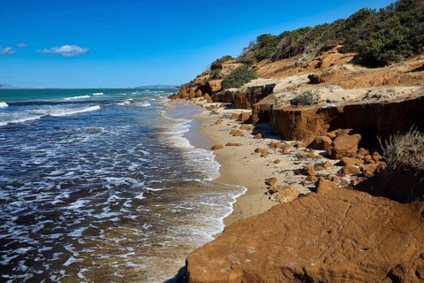 Vulcanic Beach, rocky coast with sea, waves and clear sky, natural scenery, Kos, Dodecanese, Greek