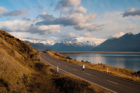 Aerial view of person walking on road on Lake Pukaki with Mount Cook in the background, New Zealand