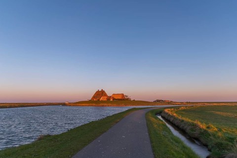 Kirchwarft with pastor and church on Hallig Hooge in the Schleswig-Holstein Wadden Sea National
