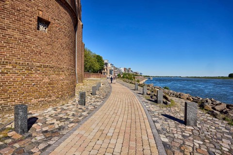 Rhine river, general architecture, brick building, waterfront, footpath, trees, walkers as a