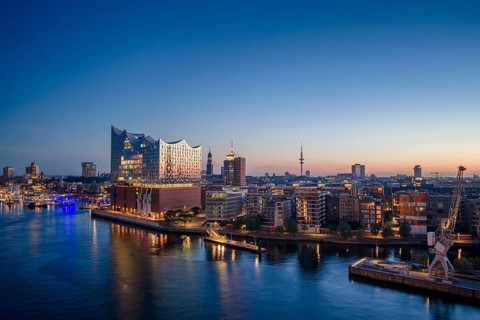 Aerial view of the sunrise on the Elbe with Elbe Philharmonic Hall, St Michael's Church (Michel)