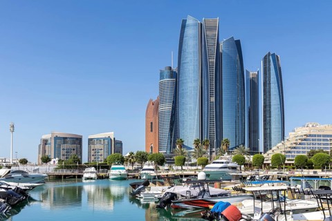 Abu Dhabi Skyline Etihad Towers skyscrapers with marina yacht harbor in Abu Dhabi, United Arab