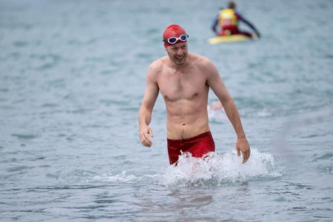 Swimmer comes out of the water after the swimming stage, Tegernsee Triathlon, Tegernsee, Upper
