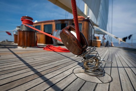 Detailed view of the deck structure of a sailing ship with rope or line and pulley or block in the