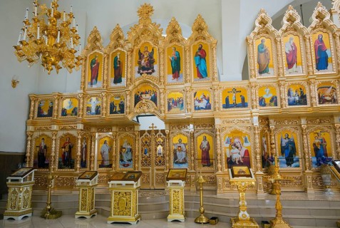 A magnificent golden iconostasis in an Orthodox church with numerous religious icons, Nicoreni
