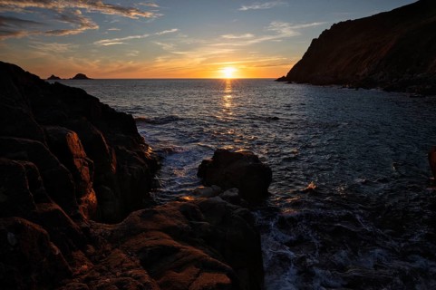 Evening, sunset at sea, The Brisons rock formation in the background, Cot Valley Beach, Porth