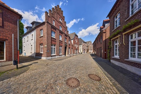 Old town, historic city center, historic brick buildings, buildings, street, façade with windows,