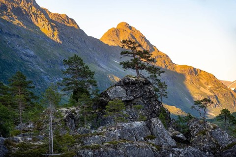 Picturesque mountain landscape in the Innerdalen high valley, silhouettes in front of mountain
