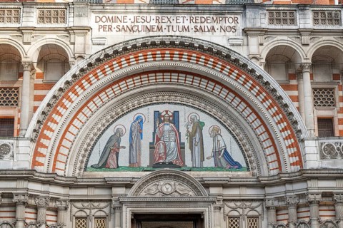 A neo-Byzantine style mosaic with biblical representations and Latin script, main entrance,